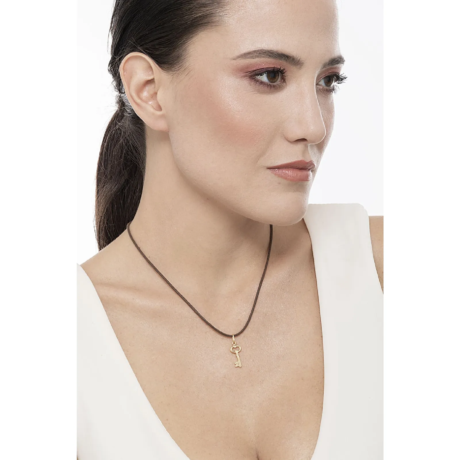 Ciondolo Chiave in oro giallo 18k.